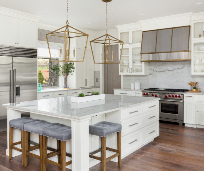 Modern Farmhouse Pendant Lighting Ideas - Gold pendants over white island