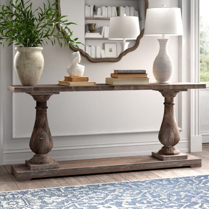 Console Table with a lamp and greenery