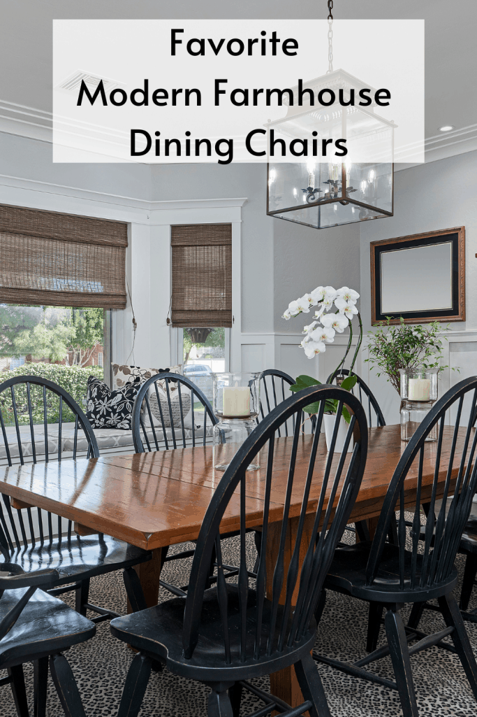 dark farmhouse table with white chairs