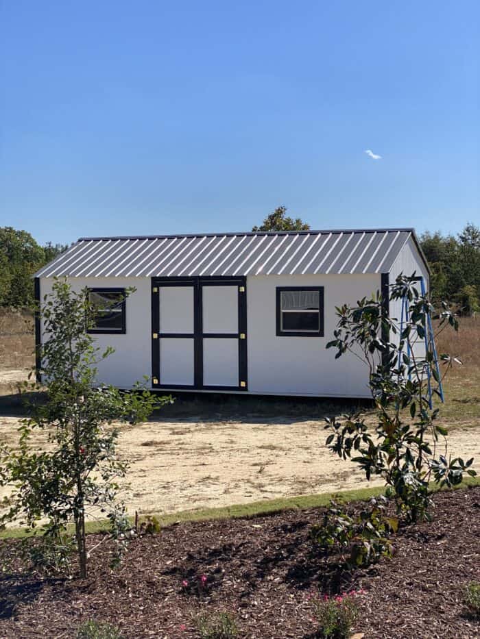 shed painted white with black trim