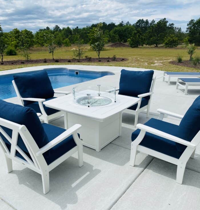 fire pit grouping by the pool - 4 chairs and a fire table