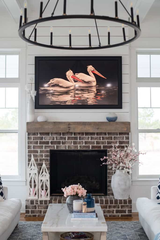 living room featuring the fireplace with the frame TV artwork above