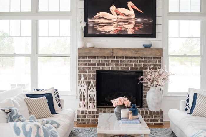 living room photo with two sofas facing each other and coffee table in between.