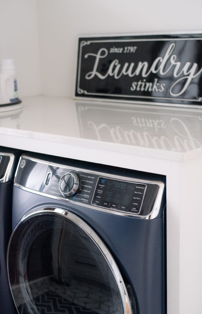 laundry stinks sign in laundry room